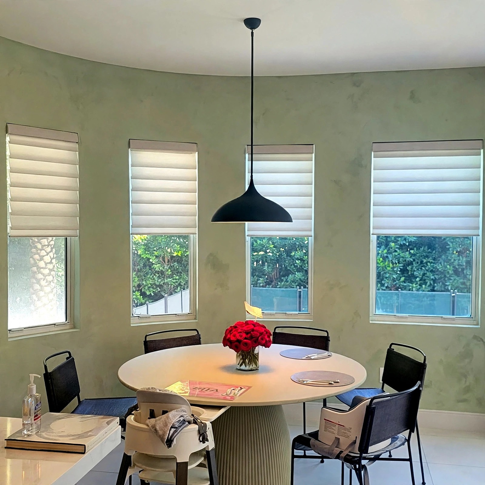 Interior wall finished in a muted green limewash