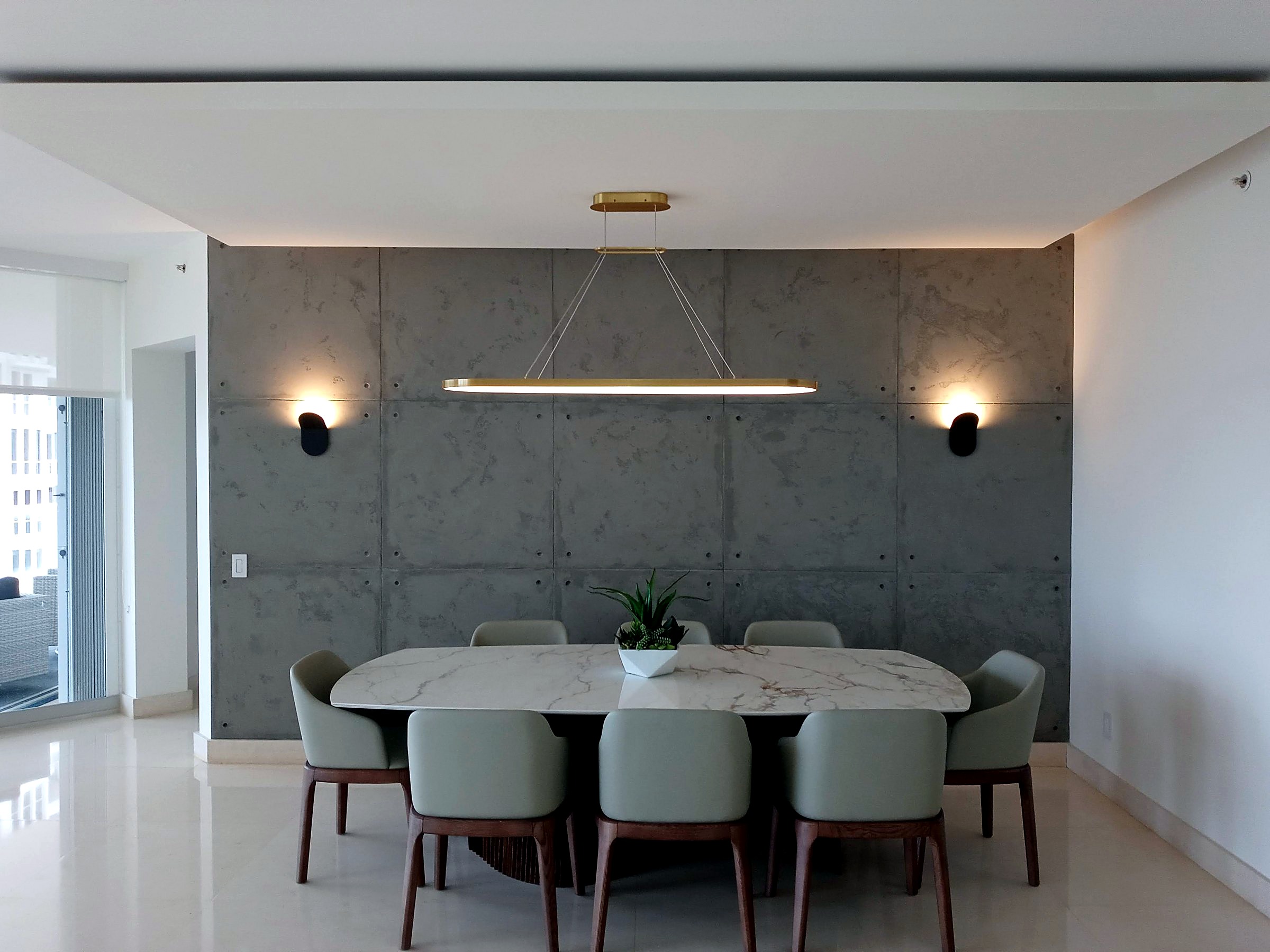Completed dining room with a microcement feature wall