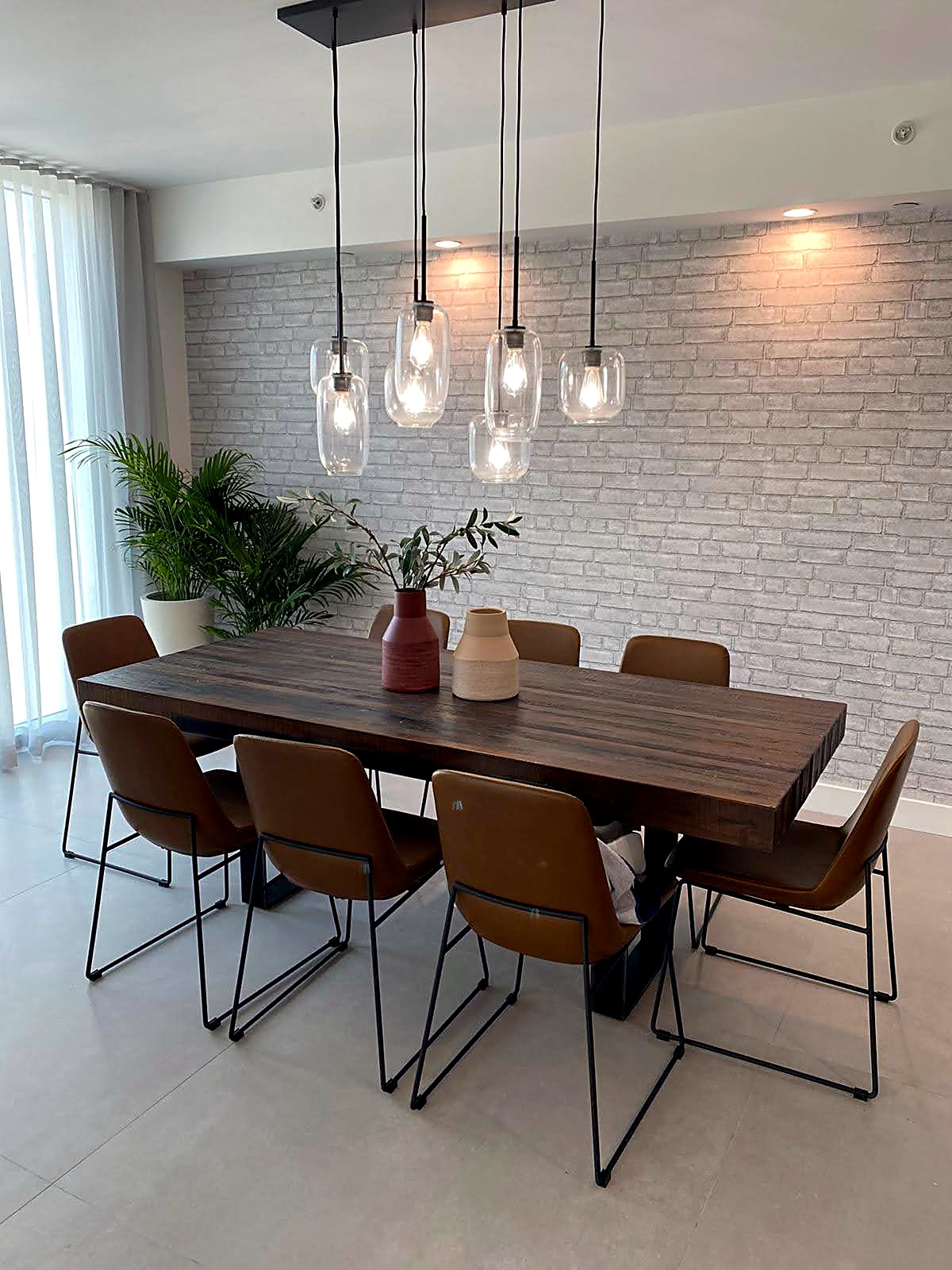 Dining area with a dimensional brick wall panel installation