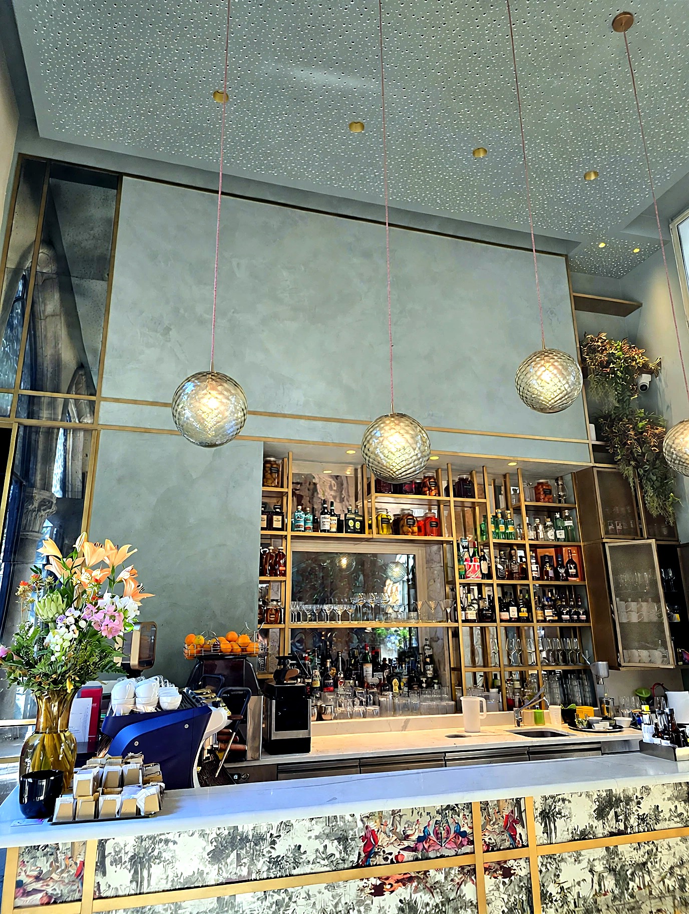 Italian café counter framed by a softly layered Roman Clay finish