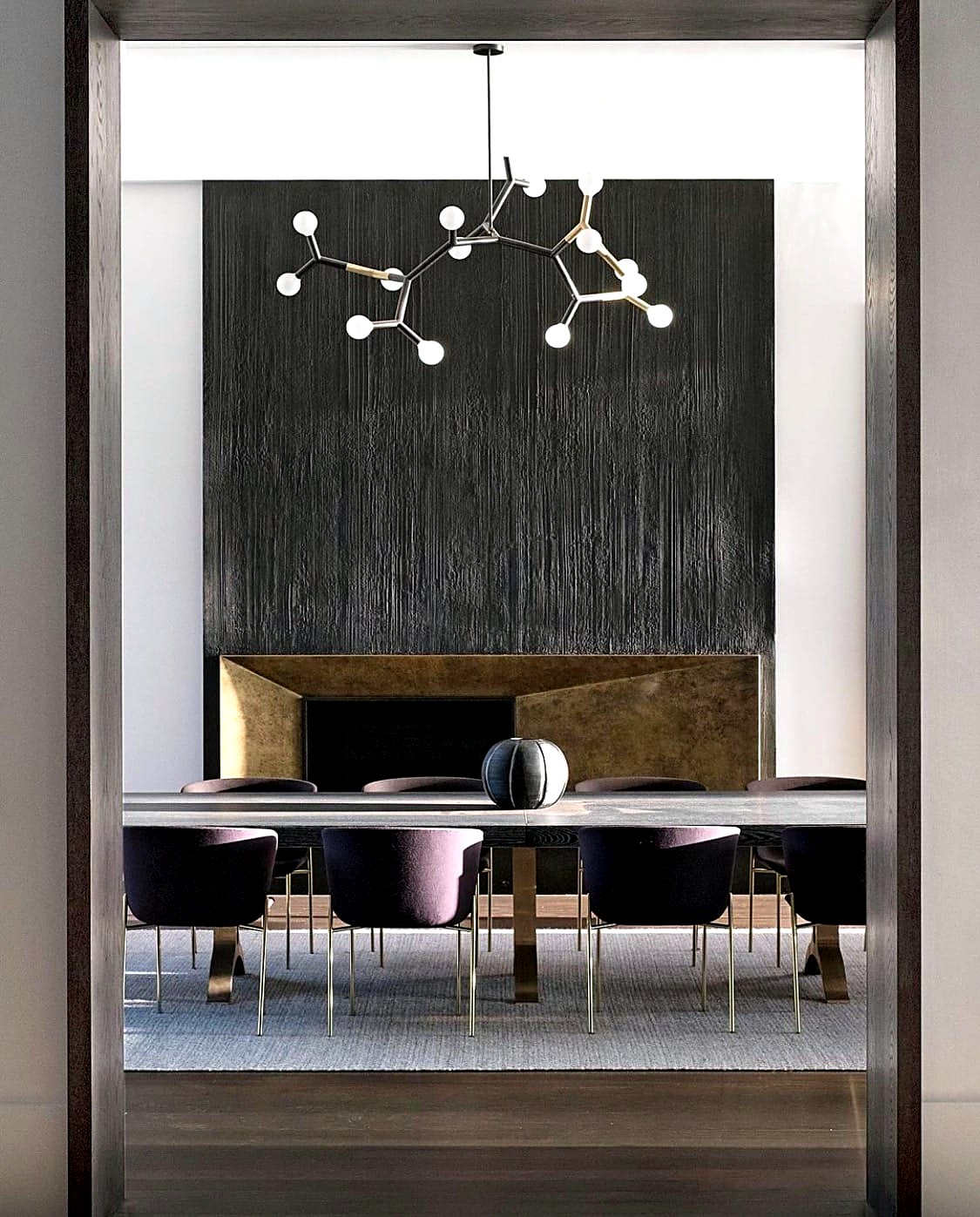 Dining room with a grooved travertine feature wall