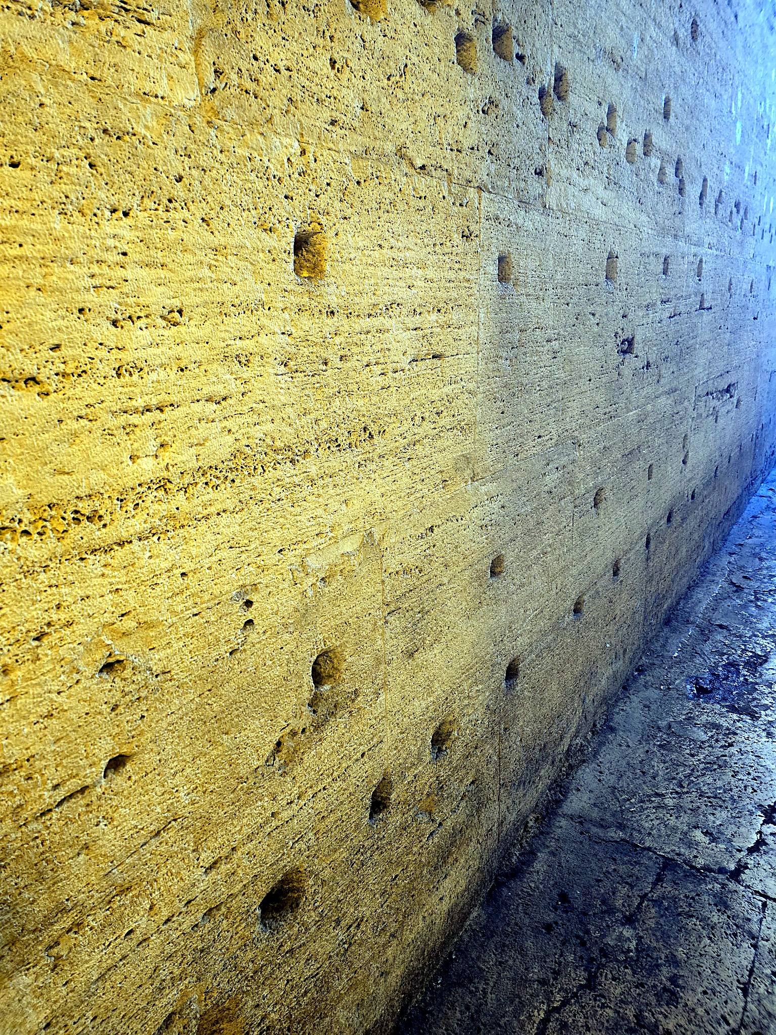 Close detail of a layered hand-applied travertine finish